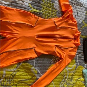 Romper. Orange . Stretchy material . Nice . Short